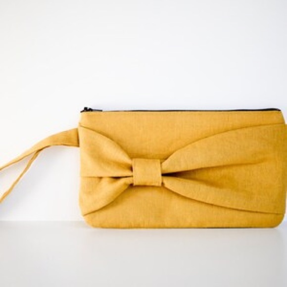 Handbags - BrighterDay Bow Clutch in Dijon